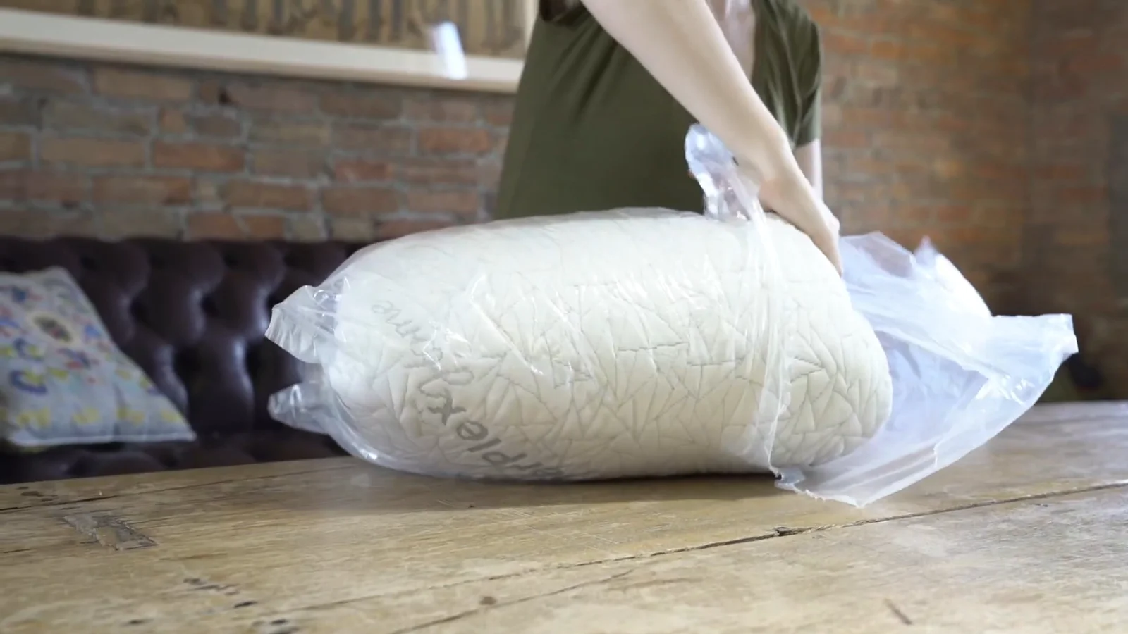 A EnerPlex shredded memory foam pillow being unpacked from its shipping roll