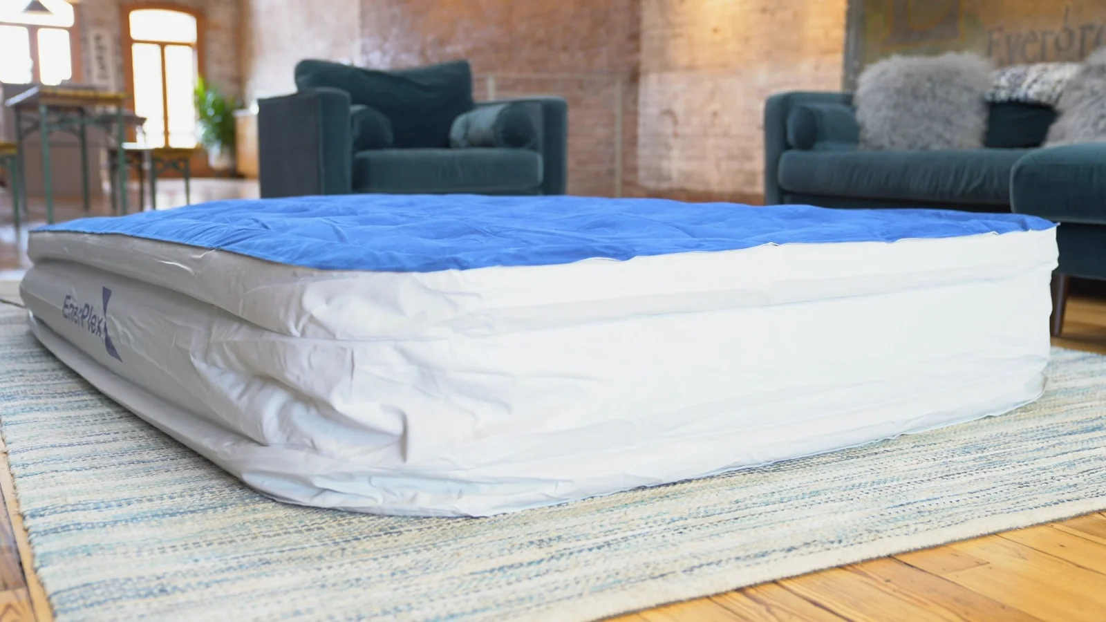 A EnerPlex double-height queen airbed inflated in a daylight loft
