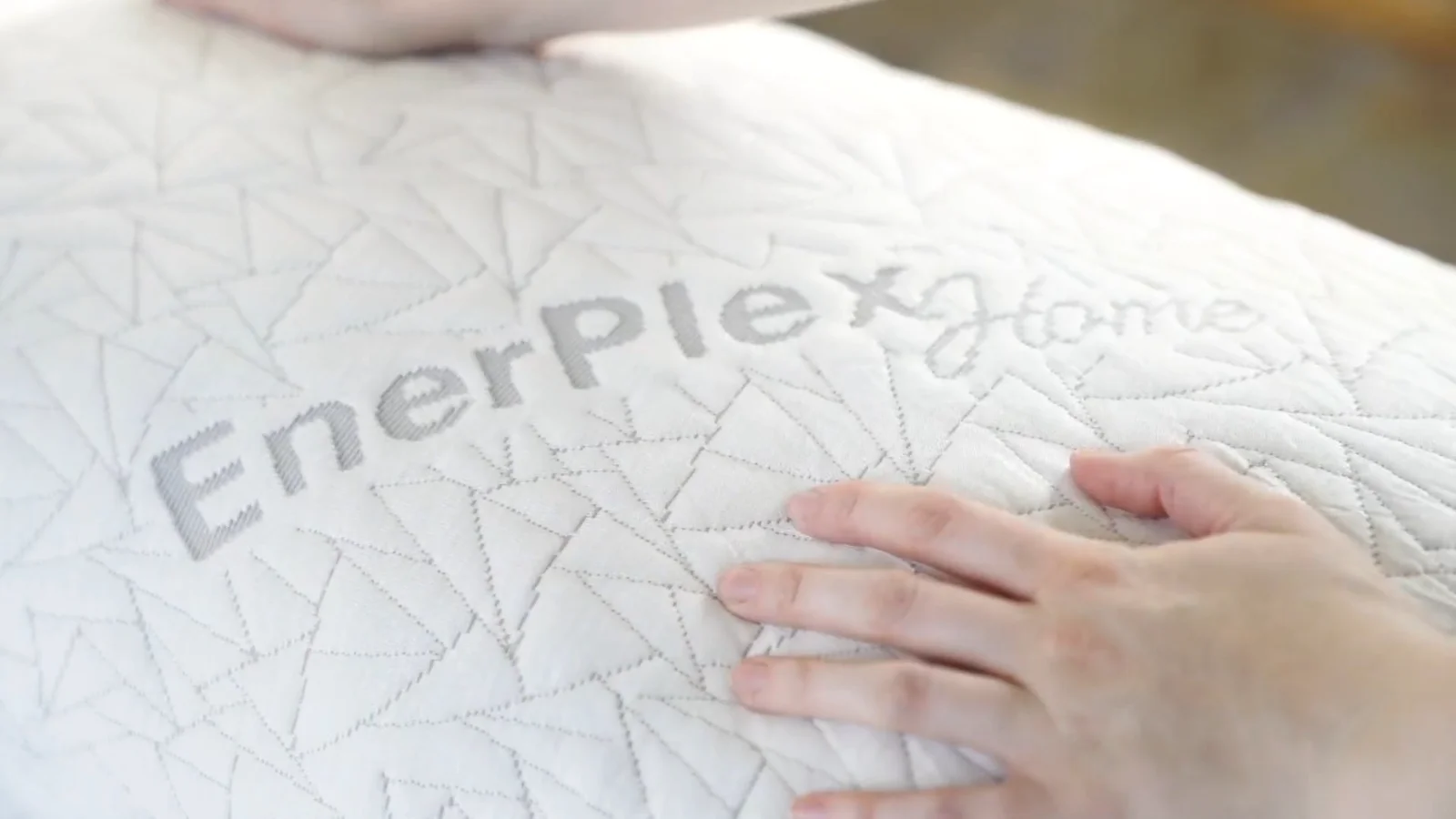 The pillow cover, quilted and zip-off washable.